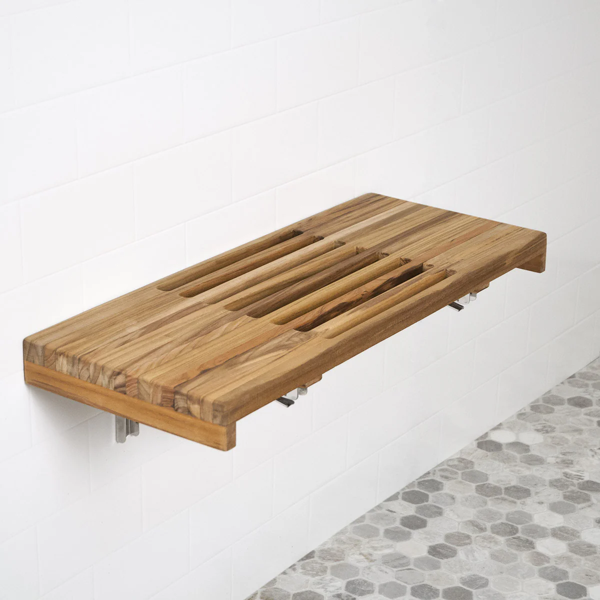 When the 24” teak seat is closed in its vertical position, what is the distance off the wall does it sit? Thank you